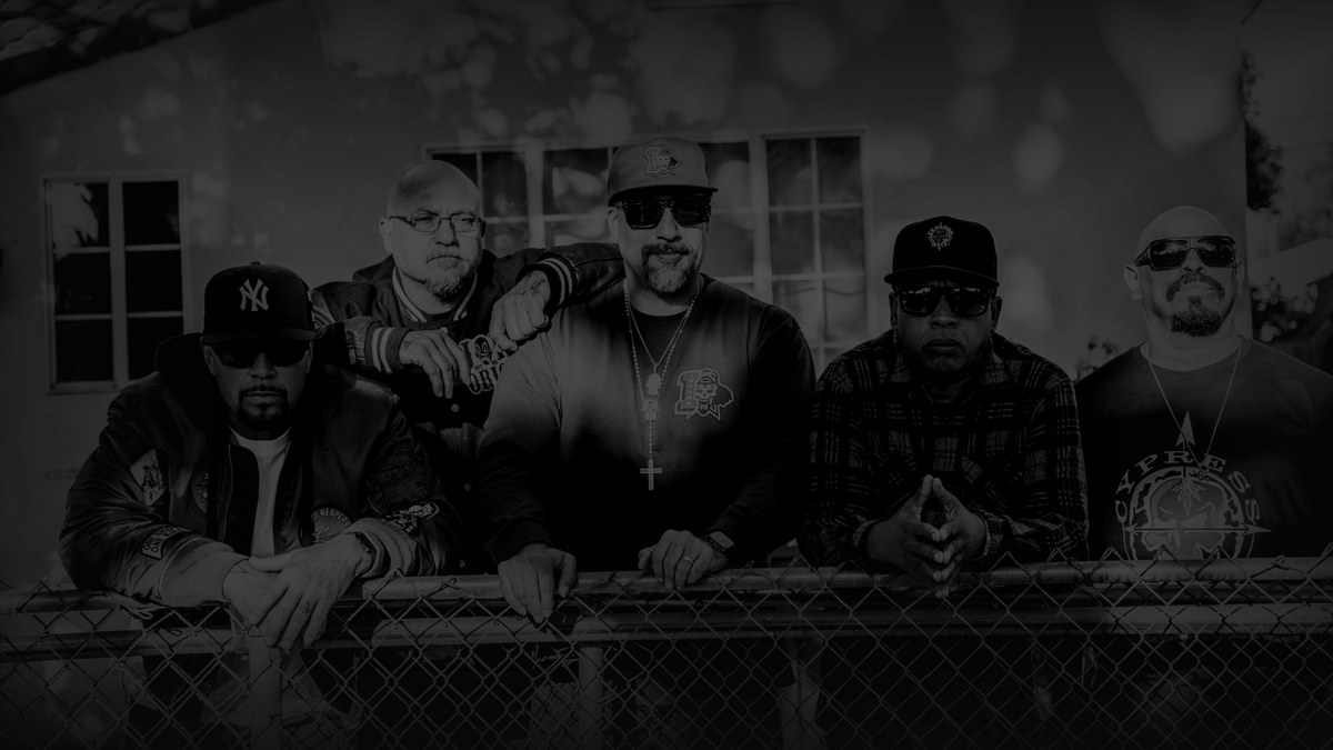 Still from Cypress Hill: Insane in the Brain (2022) — tmdb backdrop (movie 957492, key aN31B2SGbxfn1JdyFPj732er8kd); black-and-white group portrait of the crew, verified against the showtime still from variety's review. source luma 121.2, pre-darkened 0.65, baked at factor 0.45, lanczos to 1200x675, on-disk luma 26.8